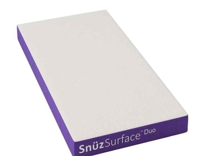 Snuz Surface Duo dual-sided cot bed mattress with a breathable mesh cover, waterproof layer, and adjustable firmness for infants up to 4 years.