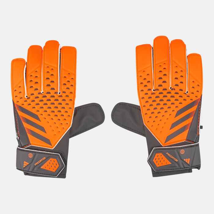 Image of a kid's football gloves by Adidas in orange .