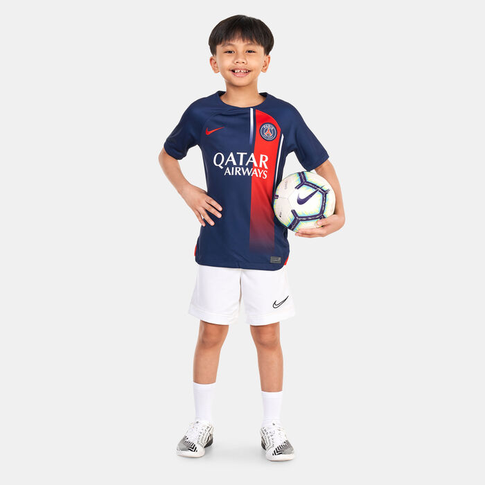 A boy wearing one of the best kids' football jerseys with raglan sleeve cut.