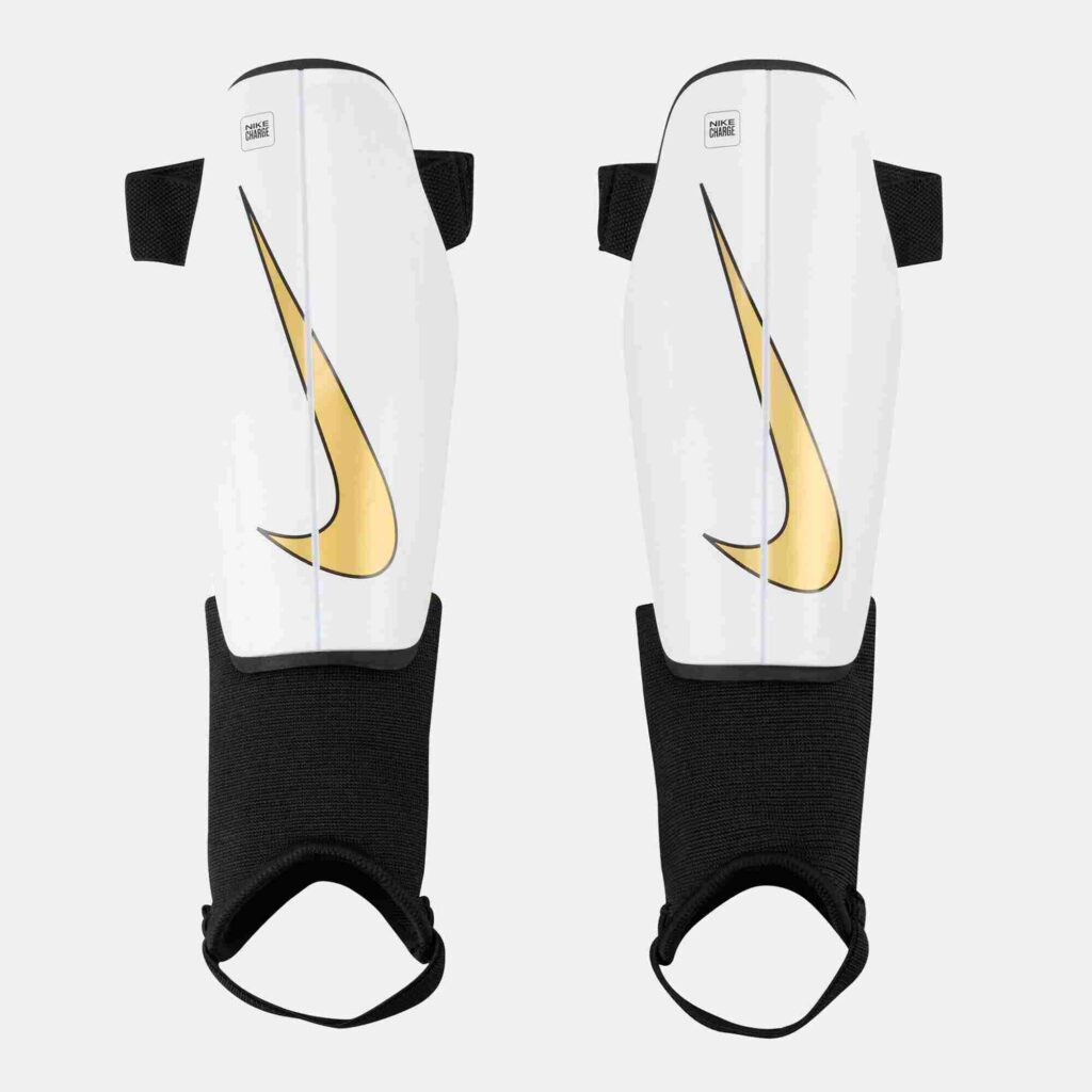 Image of a kid's shin pad by Nike in white .