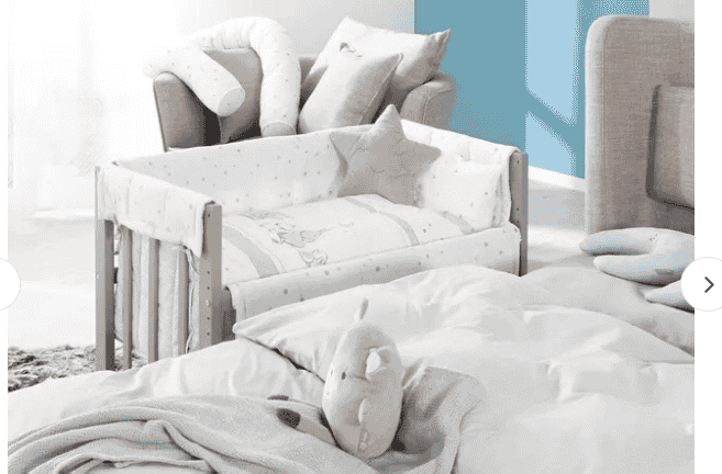 Roba 4-in-1 convertible baby crib that transforms into a co-sleeper, cradle, or bench, featuring a cushioned bumper, canopy, and mattress for newborns up to 4 years.